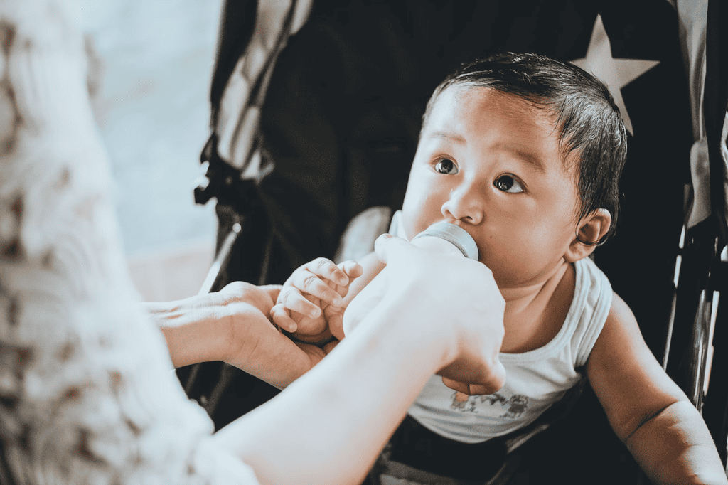Wearable breast pumps