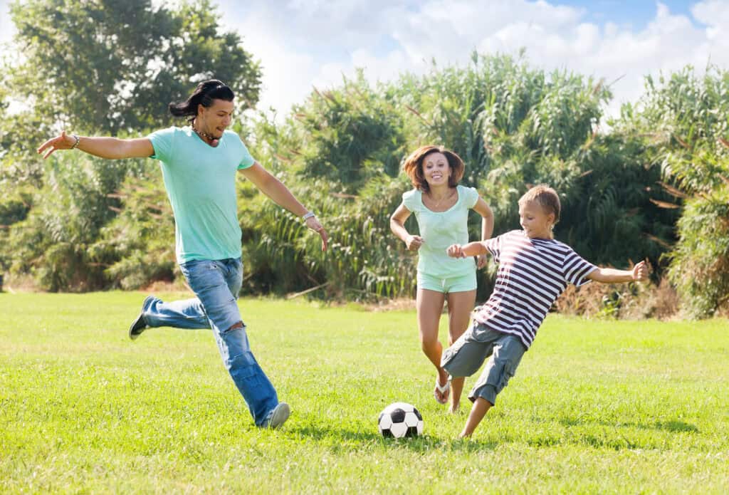  family playing football together