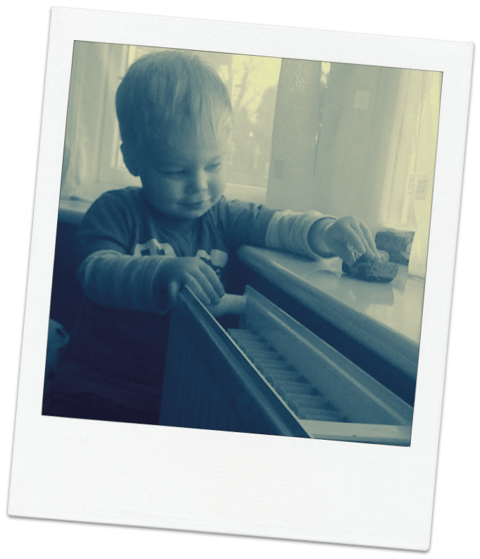 Image of child playing with cars
