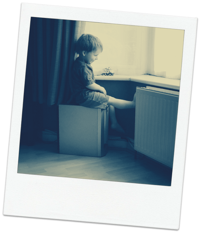 Image of child playing with cars