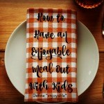 Napkin and place setting with the text how to have an enjoyable meal out with kids.