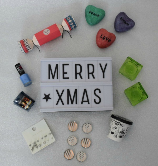 Five Under £5 Stocking Gift Ideas for her flat lay image